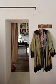 Kimono hung from coat rack next to open doorway