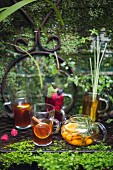 Various summer drinks on a garden table