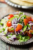 Kachumber (Indian tomato and cucumber salad with onions)