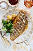 Fish with chilli butter and potatoes (seen from above)