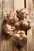 Jerusalem artichokes on wooden background