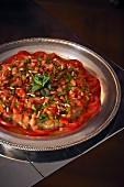 Aubergine and tomato salad with pine nuts