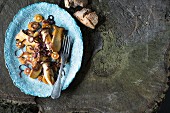 A plate of parsnips with porcini mushrooms and onions