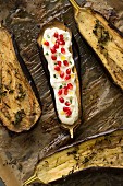 Oven-roasted aubergines with pomegranate yoghurt, thyme and olive oil