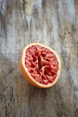 A halved, squeezed blood orange