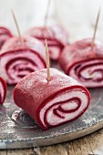 Beetroot crepe rolls filled with cream cheese