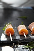 Salmon rolls with horseradish and sesame seeds