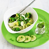 Green salad made from fresh cucumber, broccoli and peas