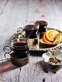 Mulled wine with spices in tea glasses