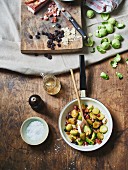 Fried Brussels sprouts with bacon, currants and almonds