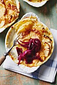 Potato gratin with red wine onions