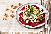 Beetroot carpaccio with goat's cheese, walnuts, lamb's lettuce and chia seeds