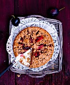 Wholemeal damson cake with crumbles, sliced