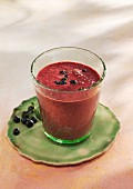 A blueberry and avocado smoothie with spinach and almond milk