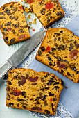 Slices of fruit cake with a knife (seen from above)