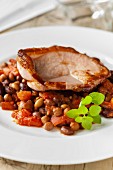 Gammon steak with spicy beans