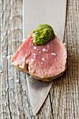 Veal fillet with sea salt and pesto (close-up)