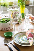 Table set with colourful summery crockery