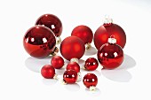 Red Christmas baubles of various sizes