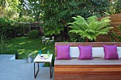 Cushions on wooden bench on terrace platform