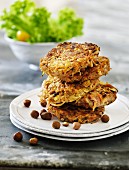 A stack of vegetable cakes with hazelnuts