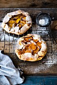 Rustic galettes with fruit and icing sugar