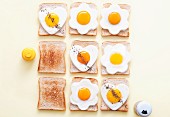 Slices of toast with fried eggs
