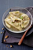 Ravioli with Roquefort cheese and walnuts in broth