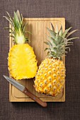 A pineapple, halved