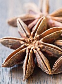 Star anise on a wooden surface (close-up)