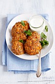 Oven-baked pork meatballs with carrots and buckwheat and a yoghurt dip