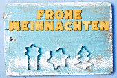 Christmas greetings written with biscuits in German and cutters