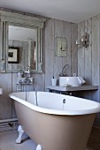 Vintage-style bathroom with board walls