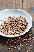 A bowl of brown flax seeds