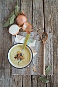 Cream of courgette soup with croutons, spices and onions