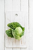 Pointed cabbage on a chopping board