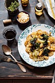 Wheel pasta with turnips, black olives and pine nuts