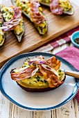 Stuffed sweet potatoes with bacon and onions