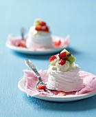 Pavlova with whipped cream and fruits
