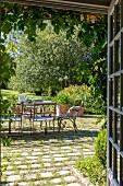 Summery seating area on paved courtyard