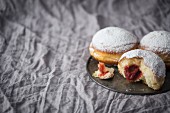 Traditional Polish donuts filled with marmalade and dusted with icing sugar