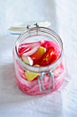 Pickled red onions with garlic and chilli peppers