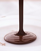 Chocolate being poured onto a plate