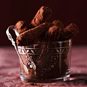 Dried plum sticks with cocoa powder