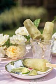 Lime ice lollies on a garden table