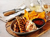 Ribs with coleslaw and tortilla chips