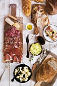 Various types of antipasti and bread (Italy)