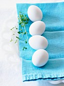 White eggs on a blue cloth