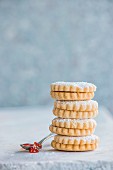 A stack of shortbread jam sandwich biscuits