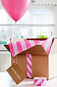 Balloon, gift voucher and open box
